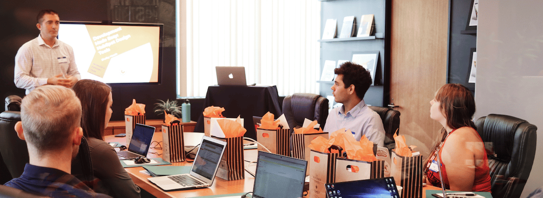 people meeting in office laptops