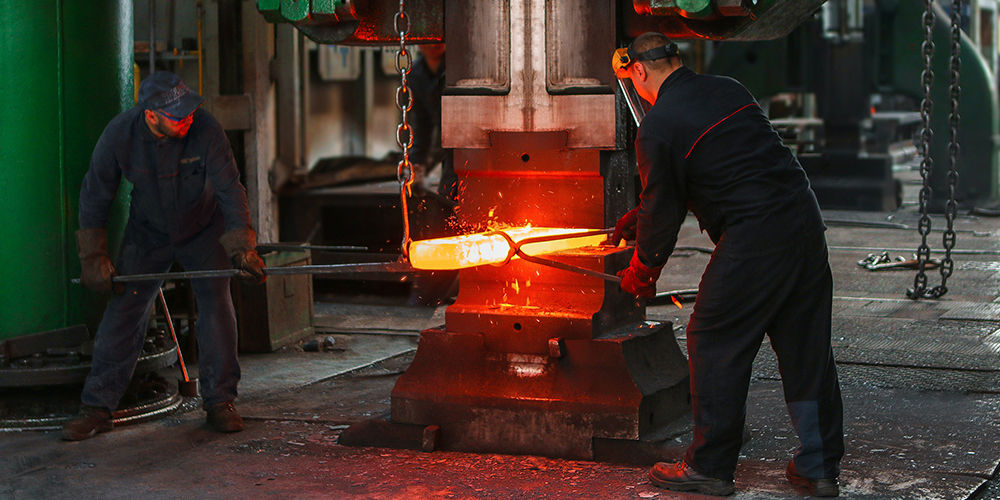 two men welding metal manufacturing